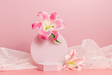 Empty geometric podium with lily flowers and fabric with golden stars on pink background. Gentle, cute and romantic concept. Display for product presentation