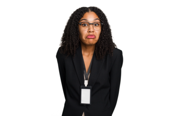 Young african american business woman with ID card isolated shrugs shoulders and open eyes confused.