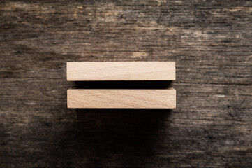 Two stacked blank wooden pegs