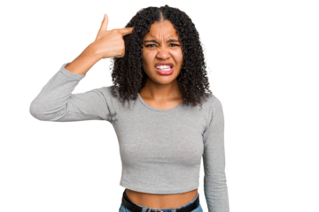 Young african american woman with curly hair cut out isolated showing a disappointment gesture with forefinger.