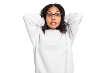 Young african american woman with curly hair cut out isolated screaming with rage.