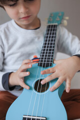 Fototapeta premium blue Ukuleles child playing 