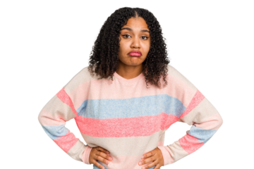 Young african american woman with curly hair cut out isolated sad, serious face, feeling miserable and displeased.