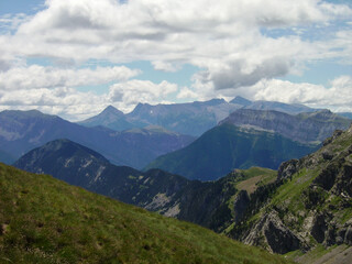 mountainous landscape of the Spanish Pyrenees. lots of green vegetation and high mountains.