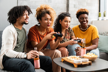 Friends play video games in the living room