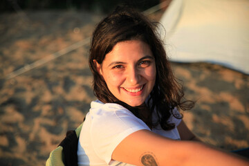 Portrait of smiling Caucasian woman at beach