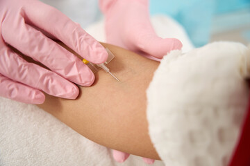 Patient having treatment in the hospital, drip chamber