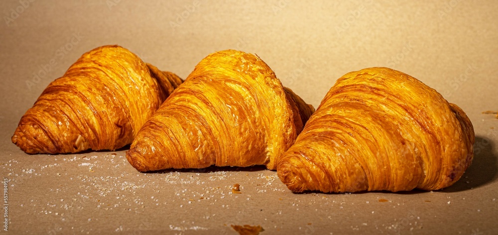 Wall mural croissant in perspective, french puff bakery. sweet dough food on kraft paper