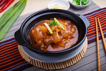 Traditional beef tendon food from China on a hot plate