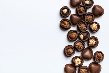 Different kinds of chocolates on colored table close-up. Top View and Flat Lay with copy space