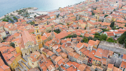 Aerial view on coast and buildings in old Town Menton, France. Drone photo. High angle view of town