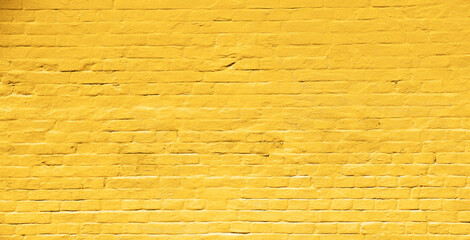 Yellow street brick wall background or texture