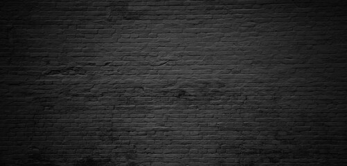 Urban black street brick wall background or texture