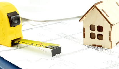 keys and the layout of the house on the drawings. the concept of buying and building housing