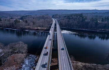 Fototapeta premium Bridge over the river -Delaware River, boundary between PA and NY 