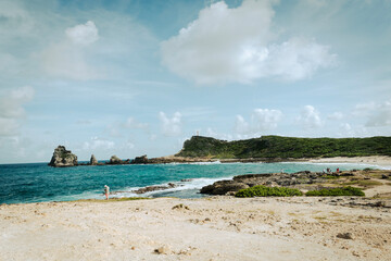 View of Atlantic ocean and coast with grassy hills in Caribbean Island of Guadeloupe