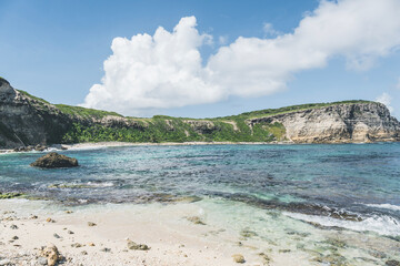View of Atlantic ocean and coast with grassy hills in Caribbean Island of Guadeloupe