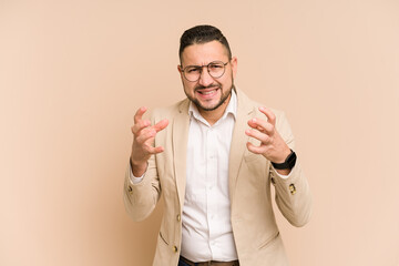 Adult latin business man cut out isolated upset screaming with tense hands.