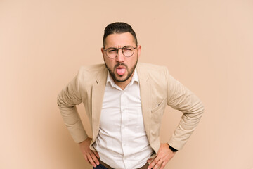 Adult latin business man cut out isolated funny and friendly sticking out tongue.
