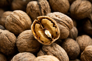 Walnut kernel against the background of other walnuts