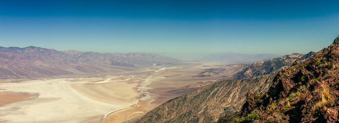 Panorama view from hill to desert salt Death Valley in Viewpoint on hill to desert salt valley in america at blue sunny day