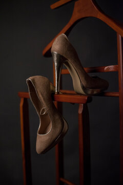 A detailed photo of an elegant pair of shoes - stilletos. 