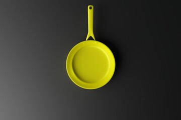 Yellow frying pan on a dark background. The concept of frying, cooking. Buying equipment for the...