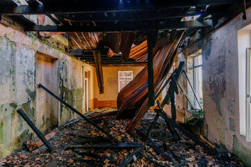 Obraz premium Burnt and ruined interior of office or apartment building. Consequences of fire or war concept