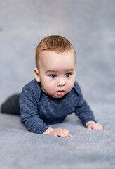 Handsome toddler portrait. Curious baby boy studying nursery room