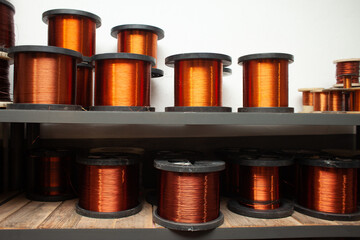 many coils of copper wire in the production workshop, winding copper cable on spools