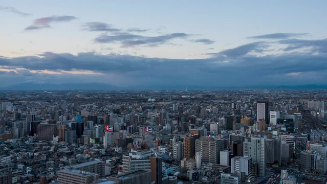 Bird view timelapse at Nagoya station and its vicinity from dusk to night with left to right panning.