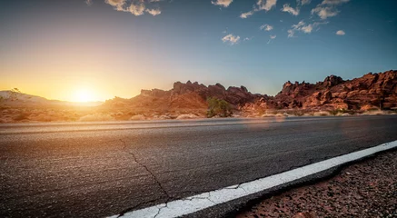 Zelfklevend Fotobehang Empty long nevada mountain road to the horizon on a sunny summer day at bright sunset © AA+W