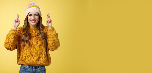Optimistic lucky cute young stylish female university student praying god help pass exams cross...