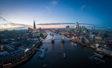 London with River Thames and Tower Bridge - amazing aerial view in the evening - LONDON, UNITED KINGDOM - DECEMBER 20, 2022