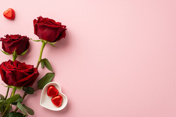 Valentine's Day concept. Top view photo of bouquet of red roses and heart shaped saucer with...