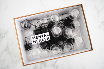 mental health text in box over group of light bulbs