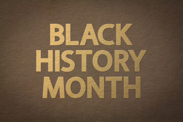Black History Month greeting concept. Golden text on old paper texture, mixed media.	