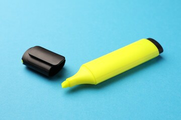 Bright yellow marker on light blue background