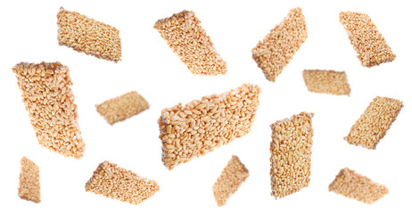Tasty sweet kozinaki flying on white background