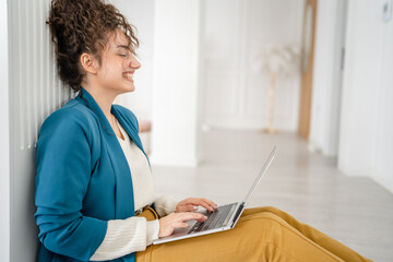 one happy caucasian woman work freelance on laptop computer at home