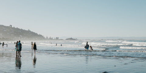 Sports water activities in the evening on the Pacific coast. The coast in New Zealand. 