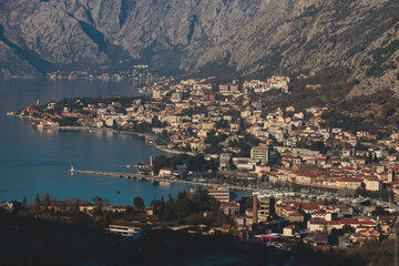 Obraz premium The Bay of Kotor, Beautiful aerial view of Boka Kotorska, with Kotor, Herceg Novi and Tivat municipalities in a sunny day, Adriatic sea and Dinaric Alps with Lovcen and Orjen mountains, Montenegro
