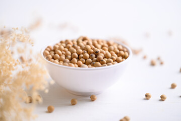 Soybean seeds in bowl, food ingredients high protein good for vegetarian and vegan