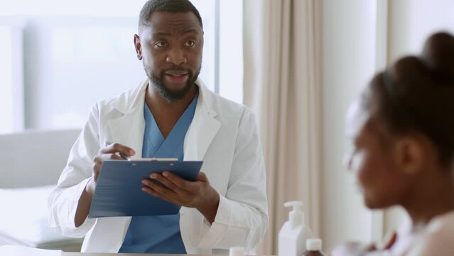 Professional african american doctor filling medical history of patient, blurred sick black woman coughing, free space