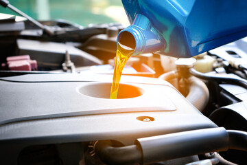Refueling and pouring oil quality into the engine motor car Transmission and Maintenance...
