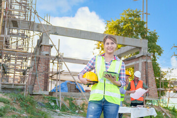 Diverse team of professionals using tablet computers on construction site. Real estate construction project. with civil engineers, architects, Arabic business investors and explorer with theodolite