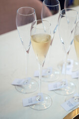 Wineglasses with wine on blurred white background
