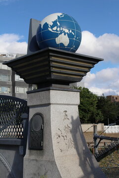 TOKYO, JAPAN - September 8, 2018: A column with a globe on the edge of of Gorin Bridge (Five Ring Bridge), a bridge which is near Yoyogi National Gymnasium and commemorates a the 1964 Tokyo Olympics.