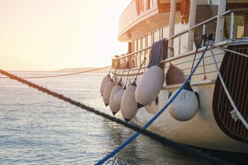 Mooring buoys on fenders of yacht in harbour, boat fenders balls	