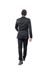 Rear view of Asian businessman walking